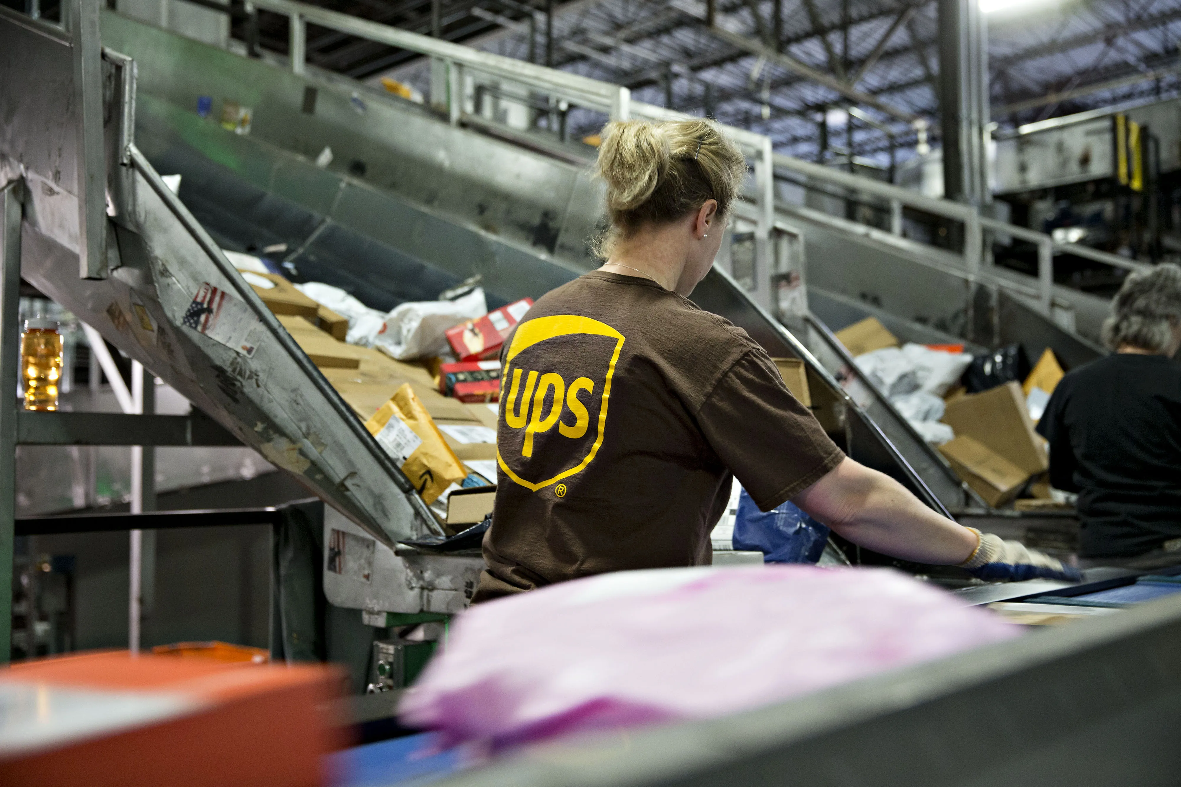 An employee sorts packages at the United Parcel Service Inc. (UPS) Chicago Area Consolidation Hub in Hodgkins, Illinois.