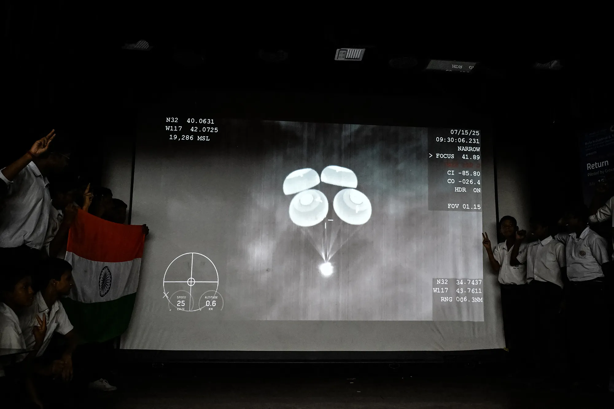School students watch a live stream of the SpaceX capsule returning to Earth from the International Space Station in Kolkata&nbsp;on July 15.