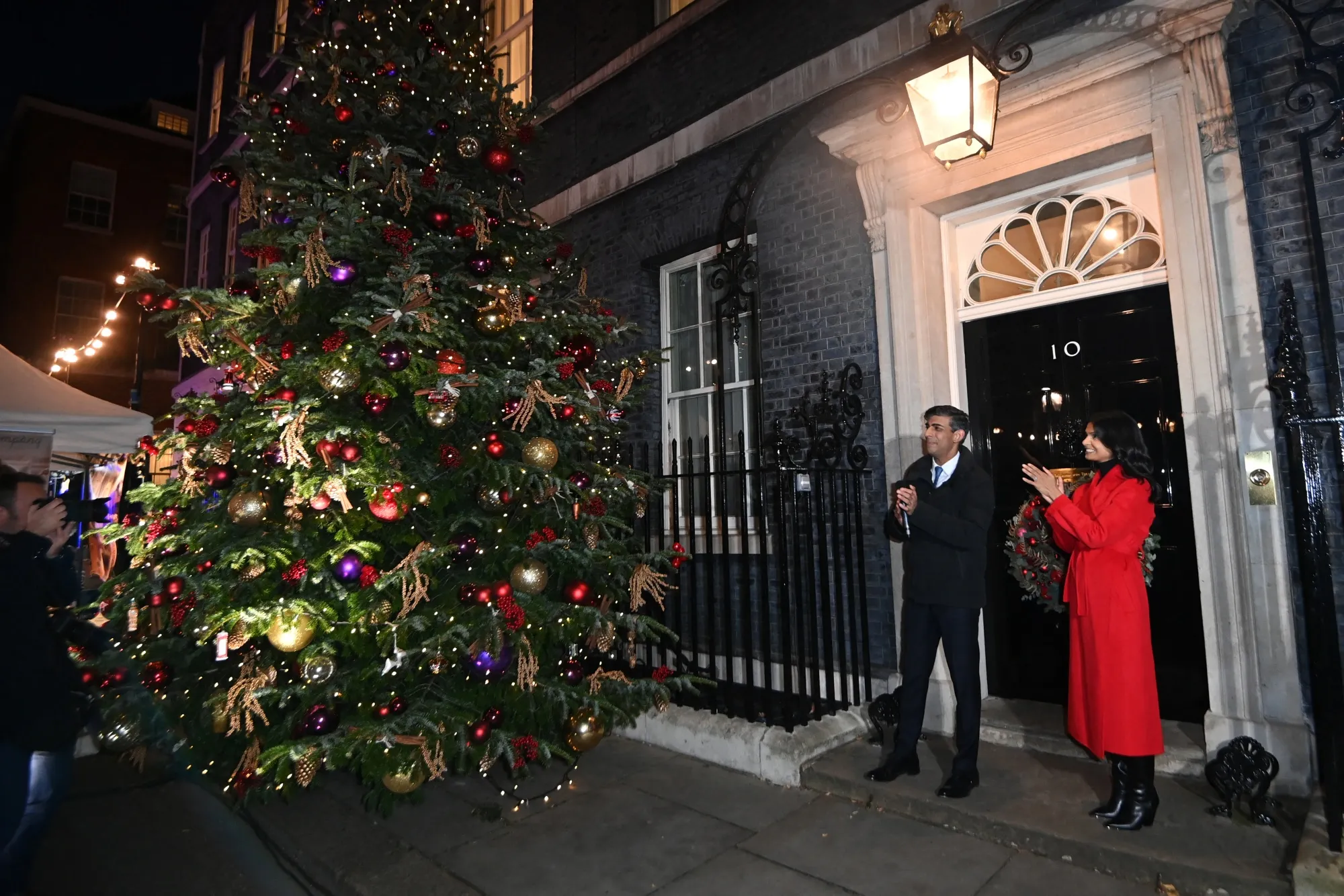 Rishi Sunak, and his wife Akshata Murty switch on the Christmas tree lights outside 10 Downing Street in London, Nov. 30.