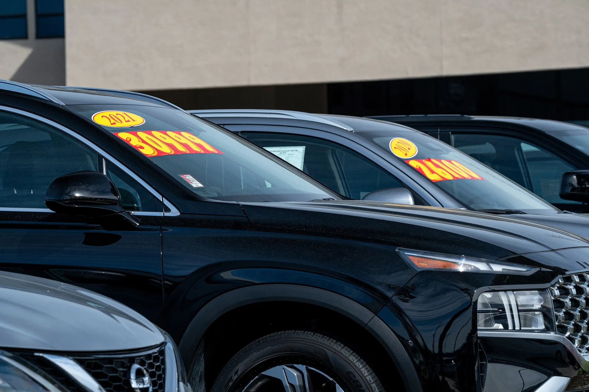 Vehicles for sale at a dealership in California.