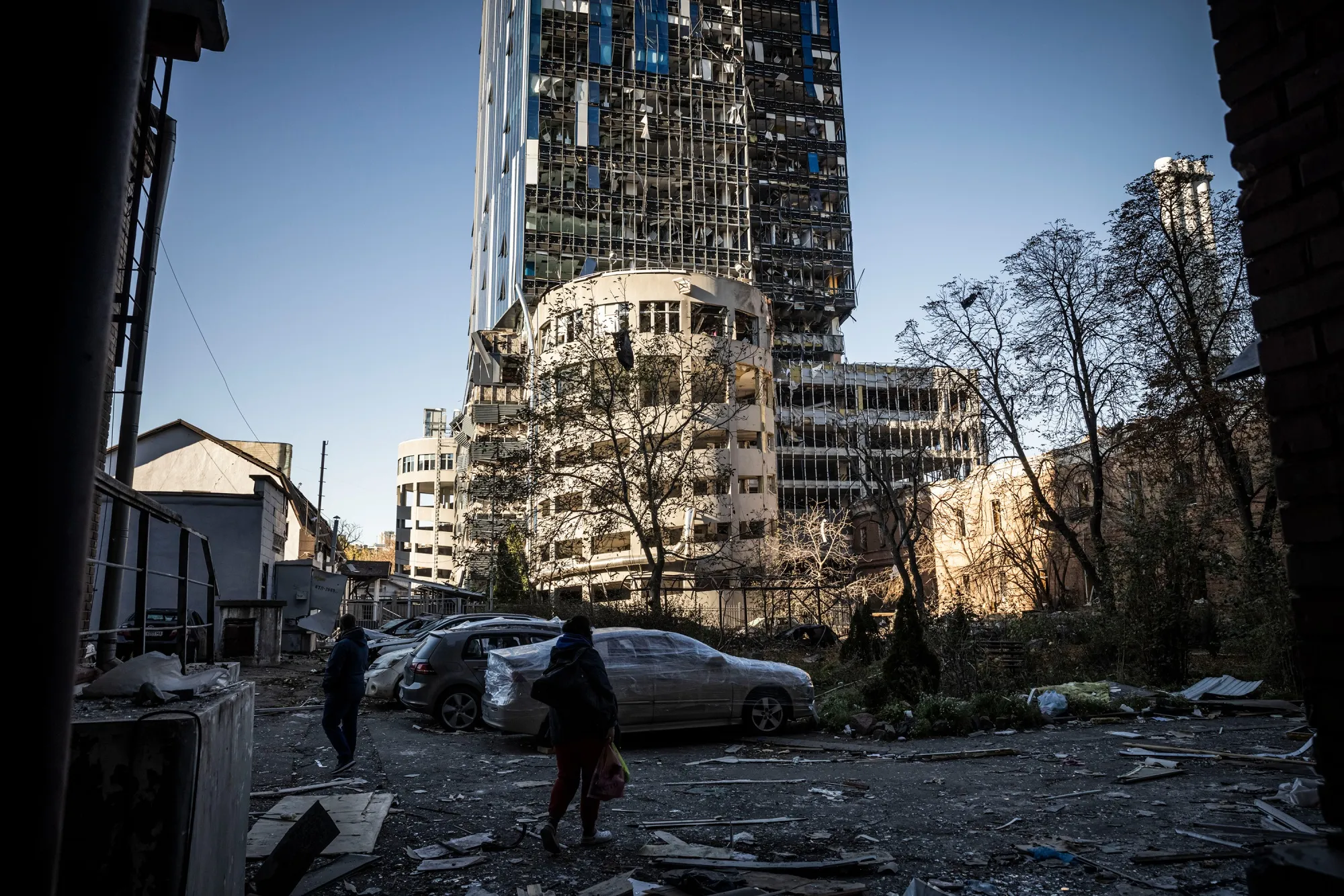 Destroyed cars amid damage caused by a missile strike in a residential area near Tower 101 in Kyiv, on Oct. 11.&nbsp;