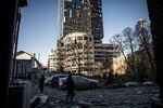 Destroyed cars amid damage caused by a missile strike in a residential area near Tower 101 in Kyiv, on Oct. 11.&nbsp;