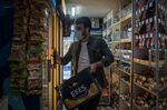 An employee stocks alcohol at a shop in Istanbul on April 28.