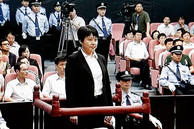 This video image taken from CCTV shows Gu Kailai, center, the wife of disgraced politician Bo Xilai, standing trial in the Intermediate People's Court in the eastern Chinese city of Hefei on Aug. 9, 2012.