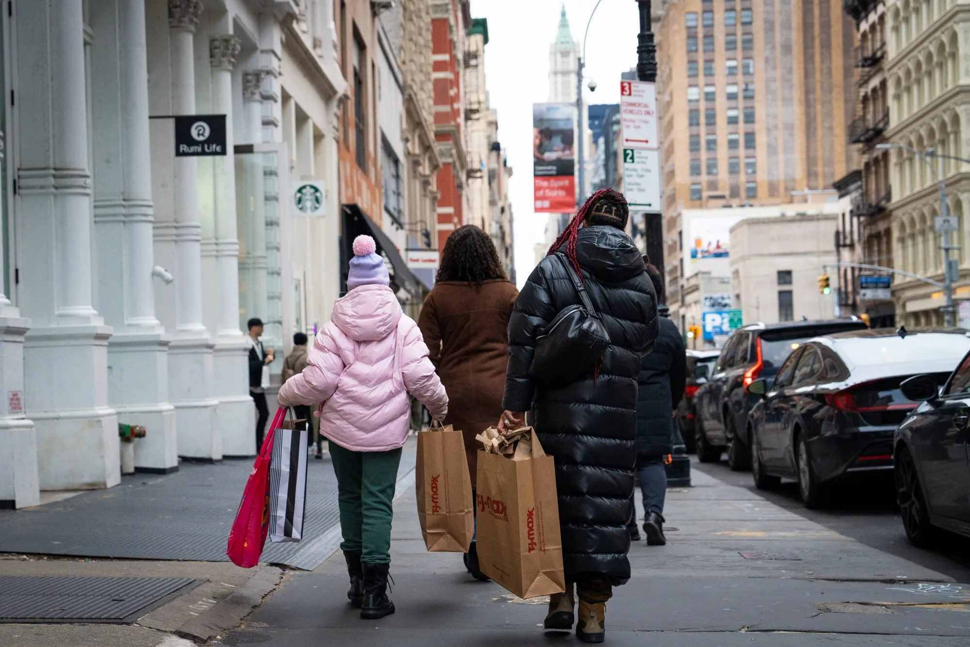 Shoppers carry T.J. Maxx bags in the SoHo neighborhood of New York.