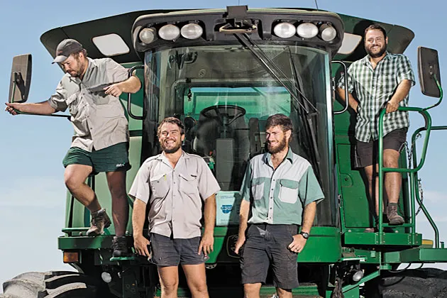 South Africans Jannie and Albert Marais, Janus Naude, and Lourens Fick are in the U.S. on temporary work visas. By fall, the crew will have cut wheat on 60 farms across the Great Plains