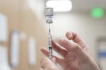 A healthcare worker prepares a dose of the Pfizer-BioNTech Covid-19 vaccine at an Oklahoma County Health Department Vaccine Clinic in Oklahoma City, Oklahoma, U.S., on Wednesday, Nov. 17, 2021. 