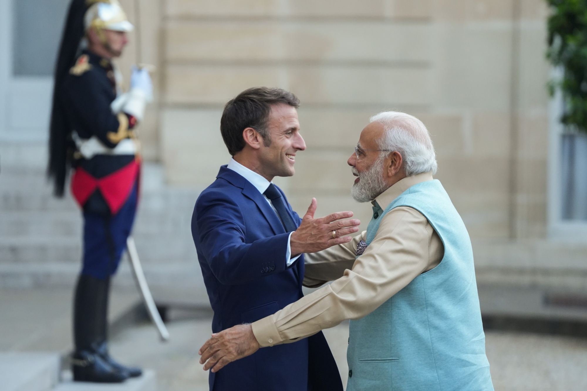 Emmanuel Macron, France's president, left, greets Narendra Modi, India's prime minister, at the Elysee Palace in Paris, France, on Thursday, July 13, 2023. India's Defence Acquisition Council approved the purchase of French submarines and fighter jets as the South Asian country diversifies purchases of military hardware beyond Russia and positions itself as a bulwark against China. Photographer: Nathan Laine/Bloomberg