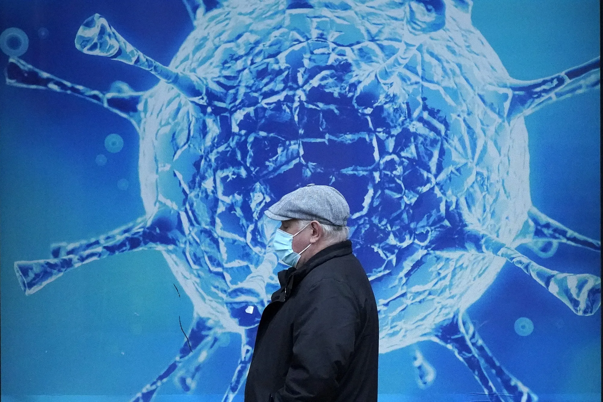 A man walks past the Oldham Regional Science Centre in Oldham, UK.&nbsp;