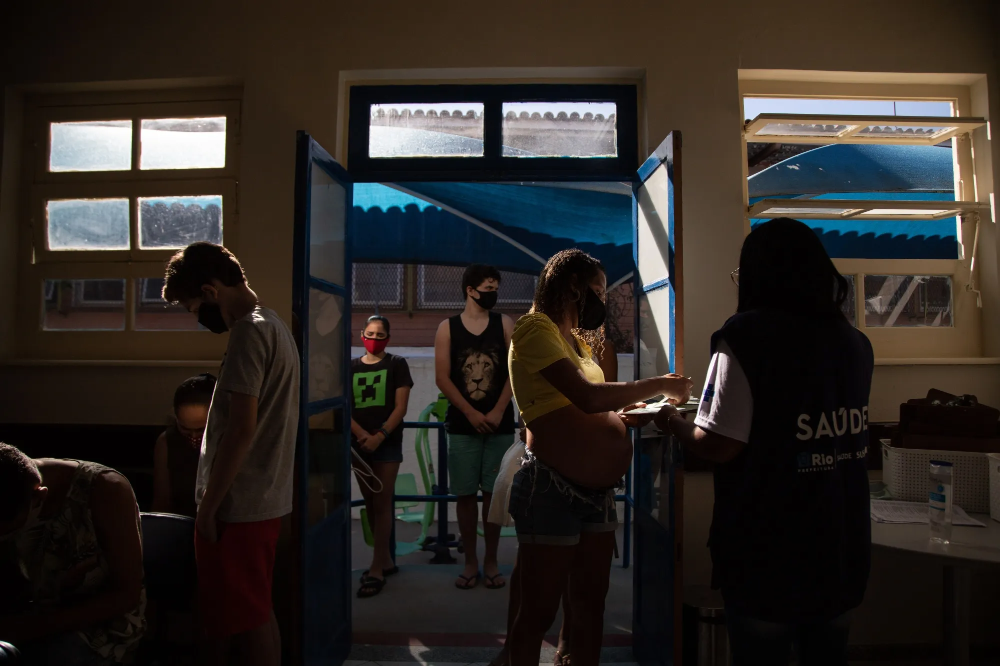 Residents line up for the Pfizer-BioNTech Covid-19 vaccine during a&nbsp;mass vaccination event&nbsp;on Paqueta Island, Rio de Janeiro state, Brazil.