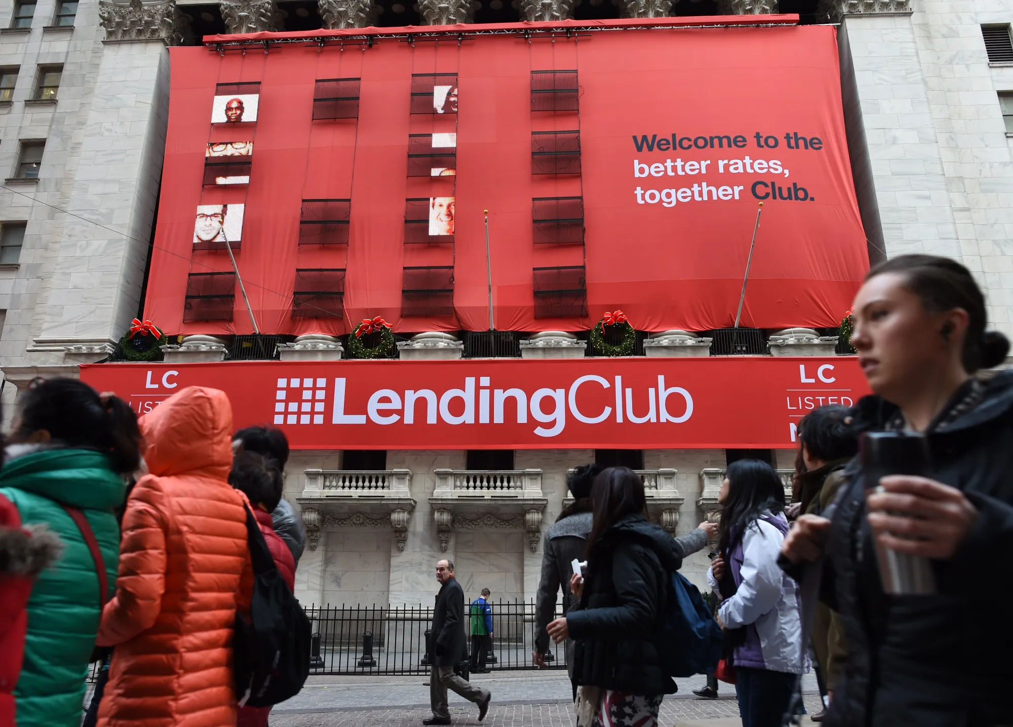 Lending Club banners hang on the facade of the New York Stock Exchange for it's IPO on December 11, 2014 in New York. Lending Club started trading on the NYSE at a high $24.75 USD per share.