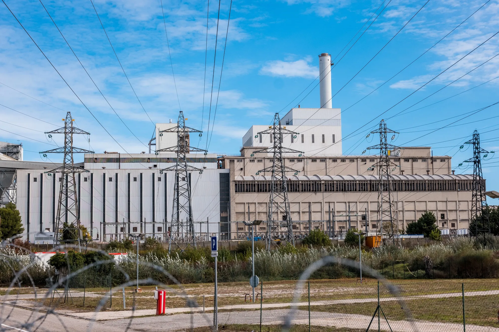 High voltage electricity transmission towers at the coal-fired Provence Power Station in Gardanne, France.