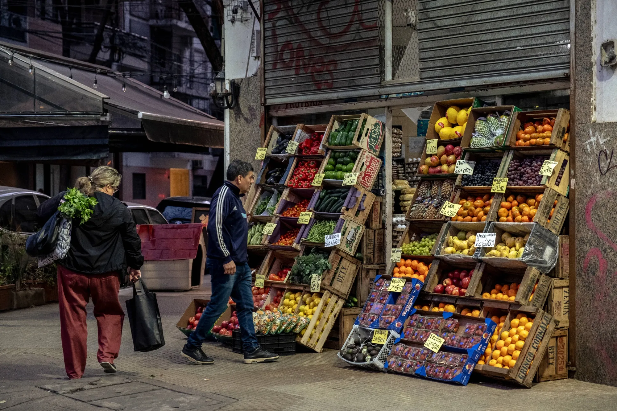 Shoppers browse produce at a grocery store in Buenos Aires.