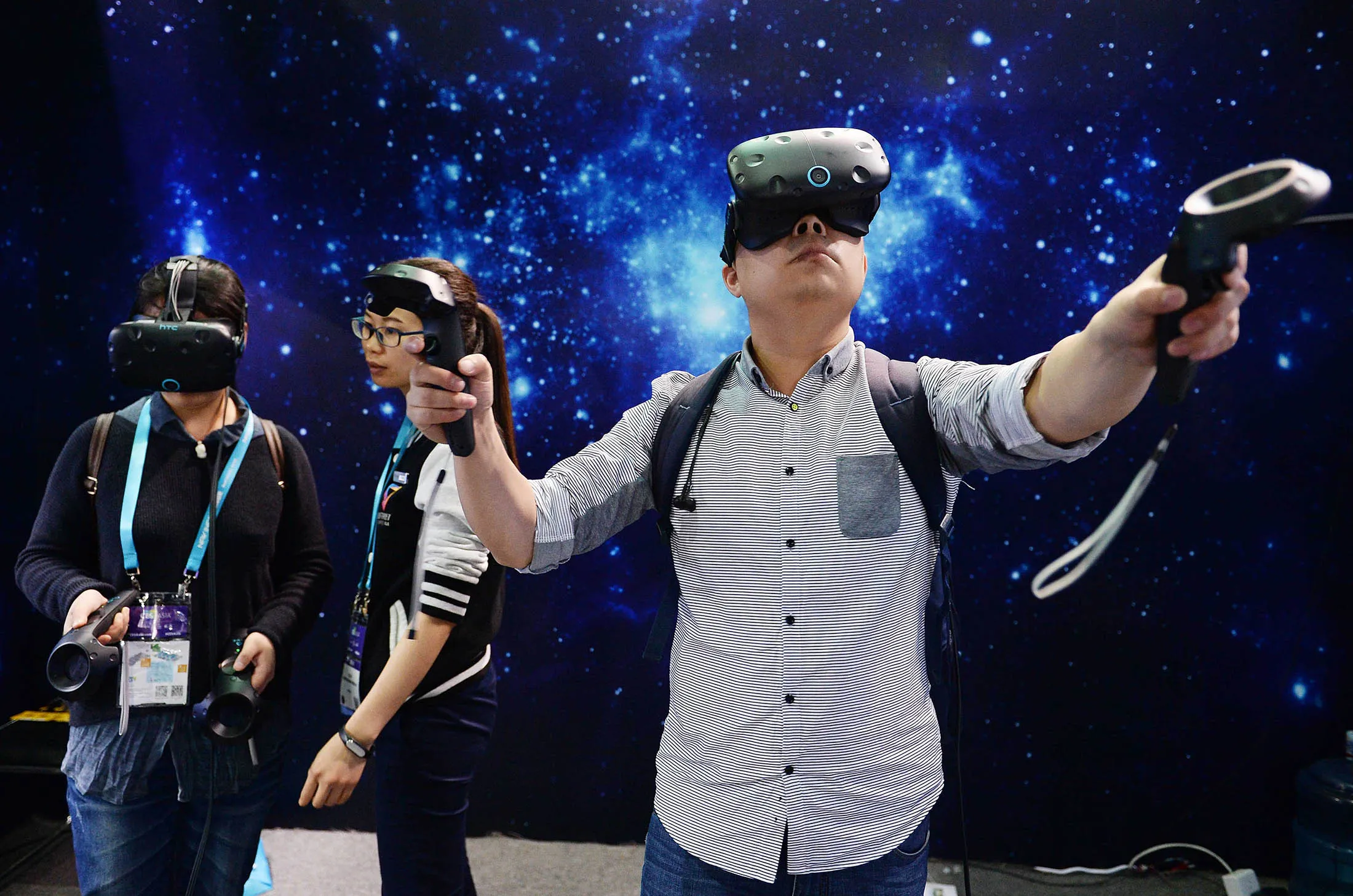 Visitors experience VR devices during the CES Asia 2016 in Shanghai on May 11.
