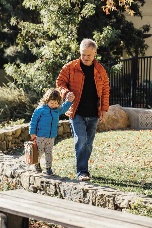 Rick Ridgeway, vice president of public engagement, arrives with his granddaughter at Patagonia for a day of work and play.