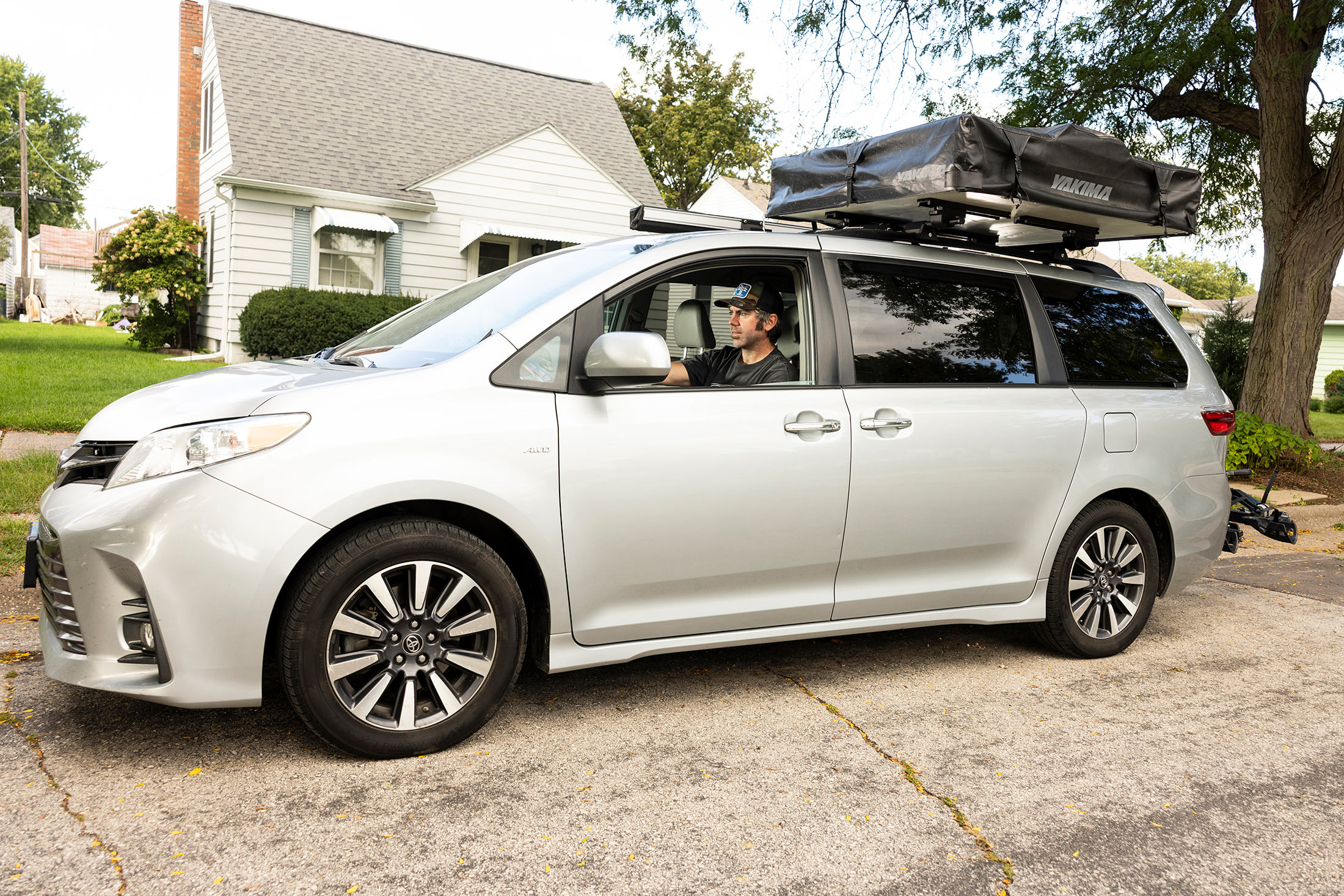 Casey McCauley with his minivan in La Crosse, Wis.