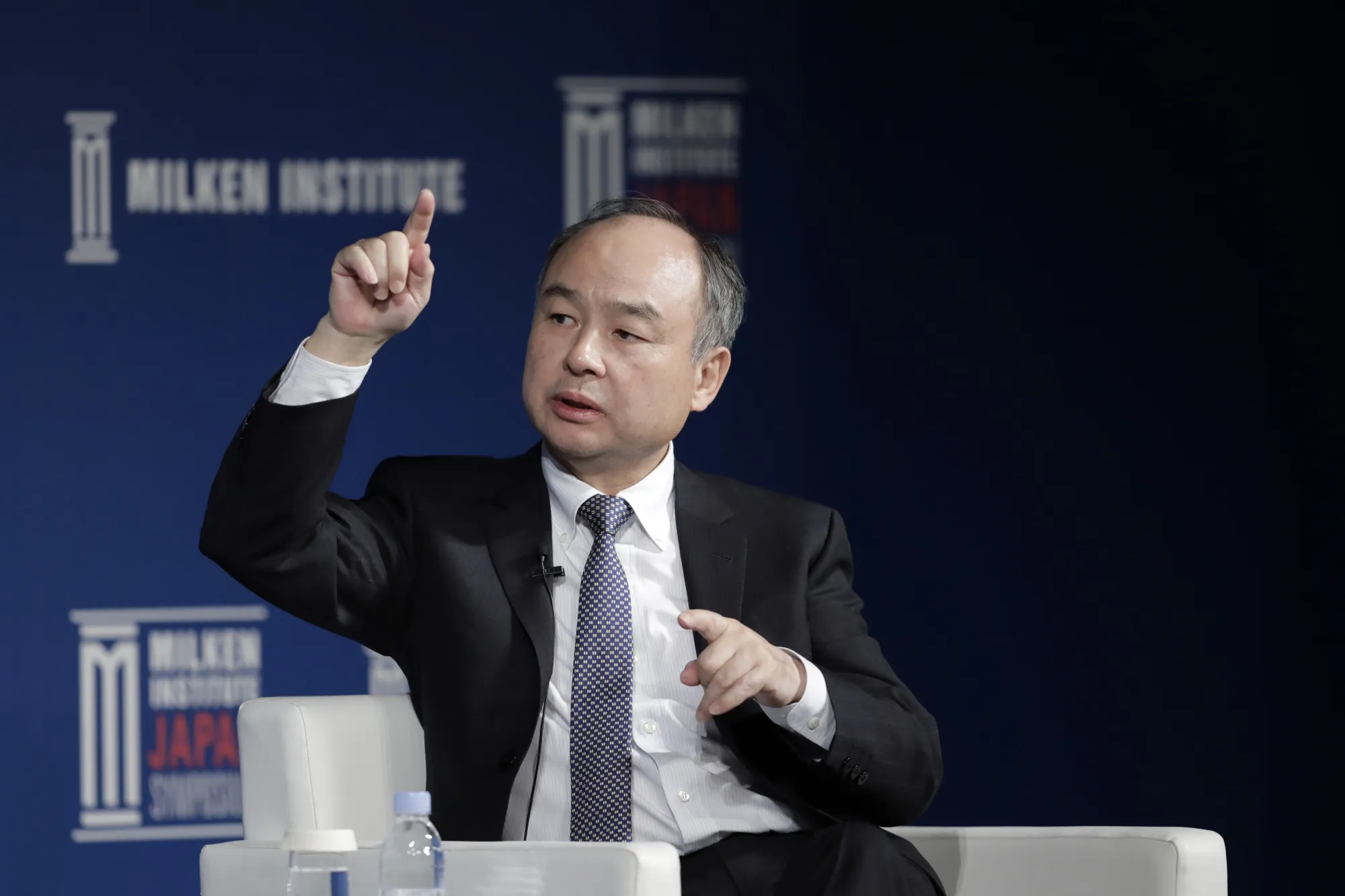 Masayoshi Son speaks at the Milken Institute conference in Tokyo on March 25.