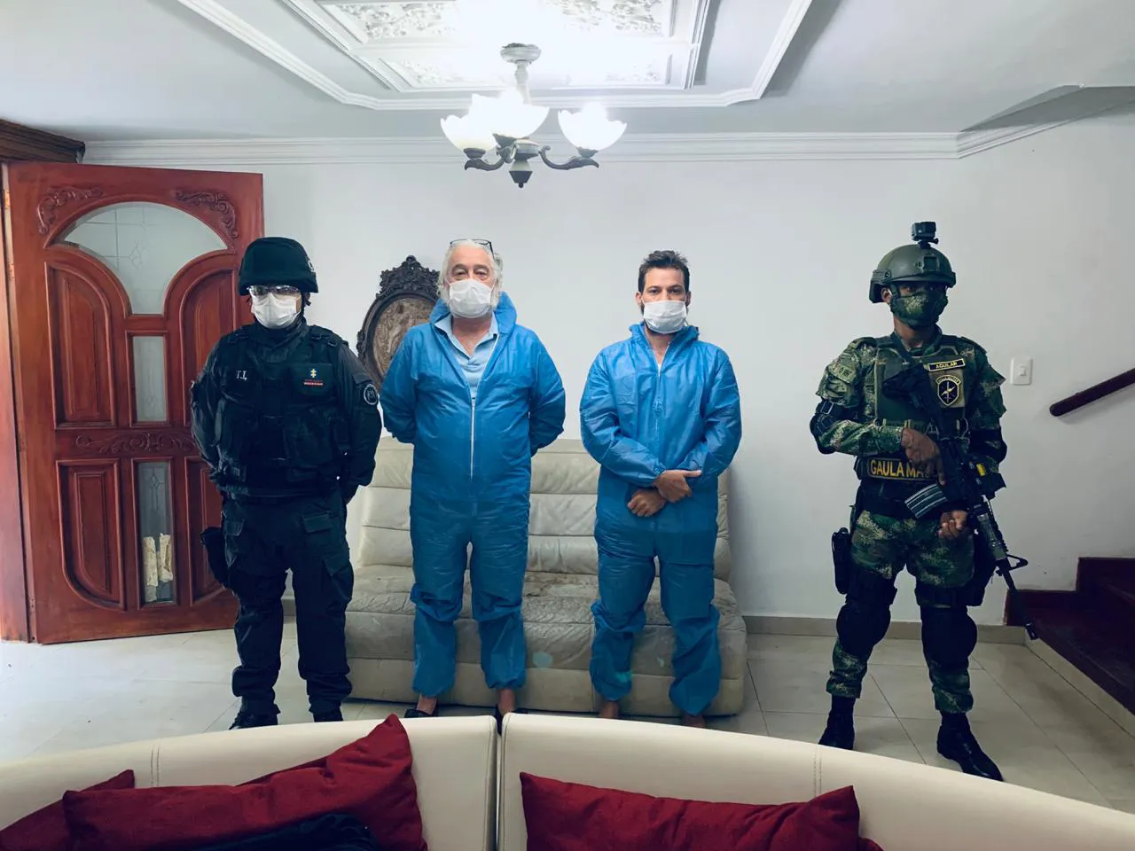 Mark Grenon (second from left) and his son Joseph Grenon, were arrested in Colombia in&nbsp;2020 before their return to the US to face criminal charges.
&nbsp;