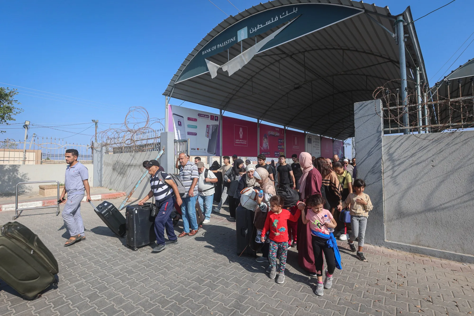 Palestinians with dual citizenship seeking permission to leave Gaza at the Rafah border crossing into Egypt.