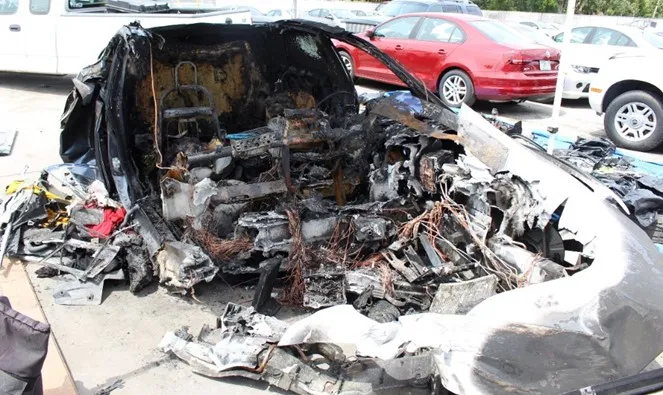 Remains of the Tesla Model S at a storage yard.