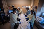 Healthcare workers prone a patient in the Covid-19 ICU&nbsp;overflow area at a hospital in Mission Hills, California, on Feb. 5.&nbsp;