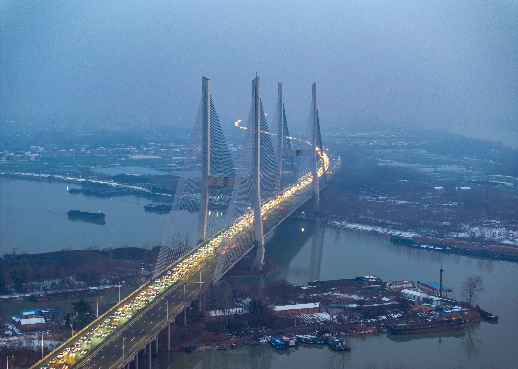 Traffic jam on the Huaian Bridge on the Changzhou-Shenzhen Expressway as motorists return home for the Spring Festival holiday in Huai’an on Feb. 8.