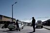 Police officers guard a crime scene in Cape Town.
