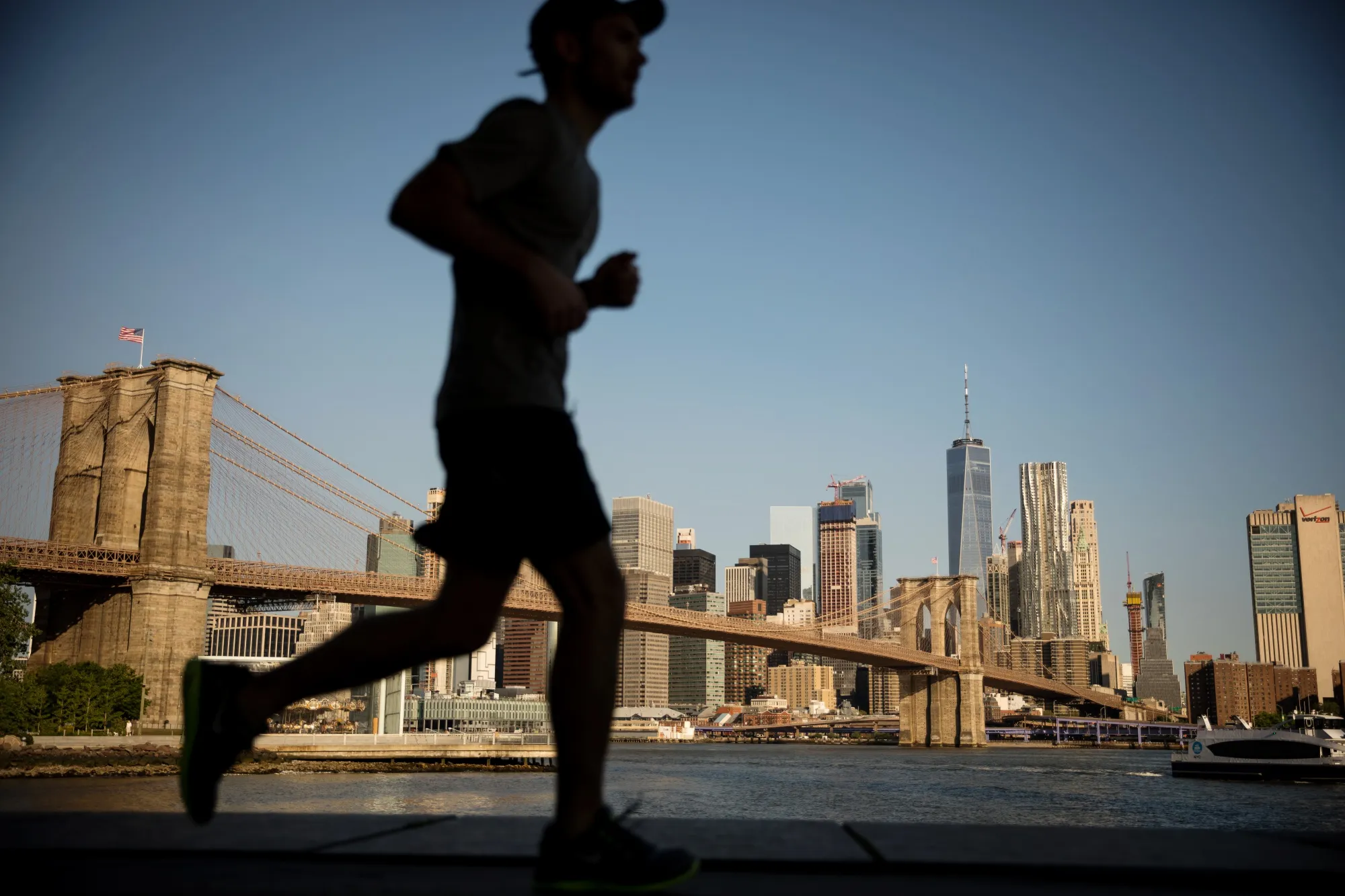 A jogger runs in Main Street Park in the Brooklyn borough of New York.