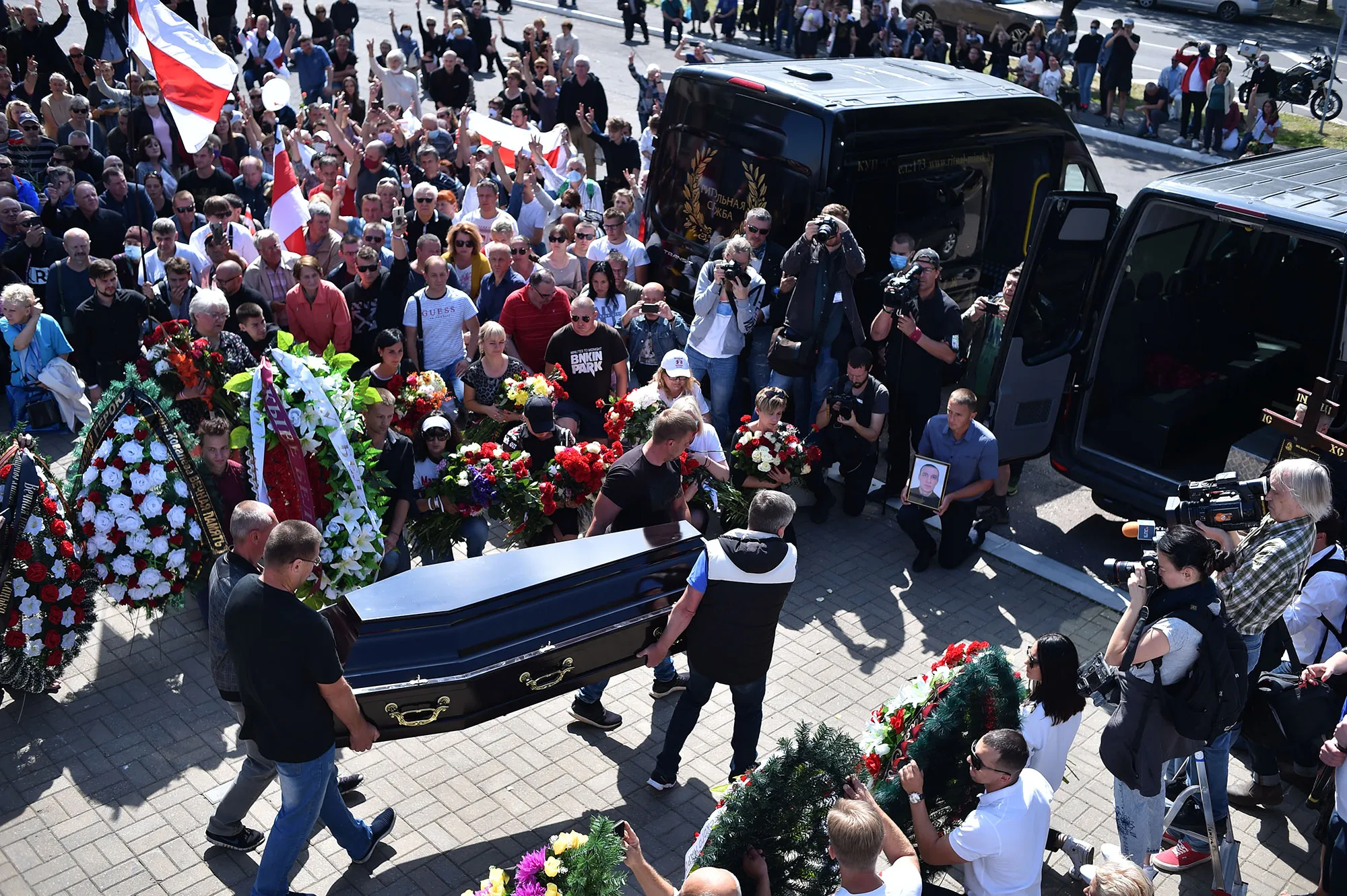 Men carry a coffin with the body of Alexander Taraikovsky, a protester who died amid clashes, in Minsk on August 15.