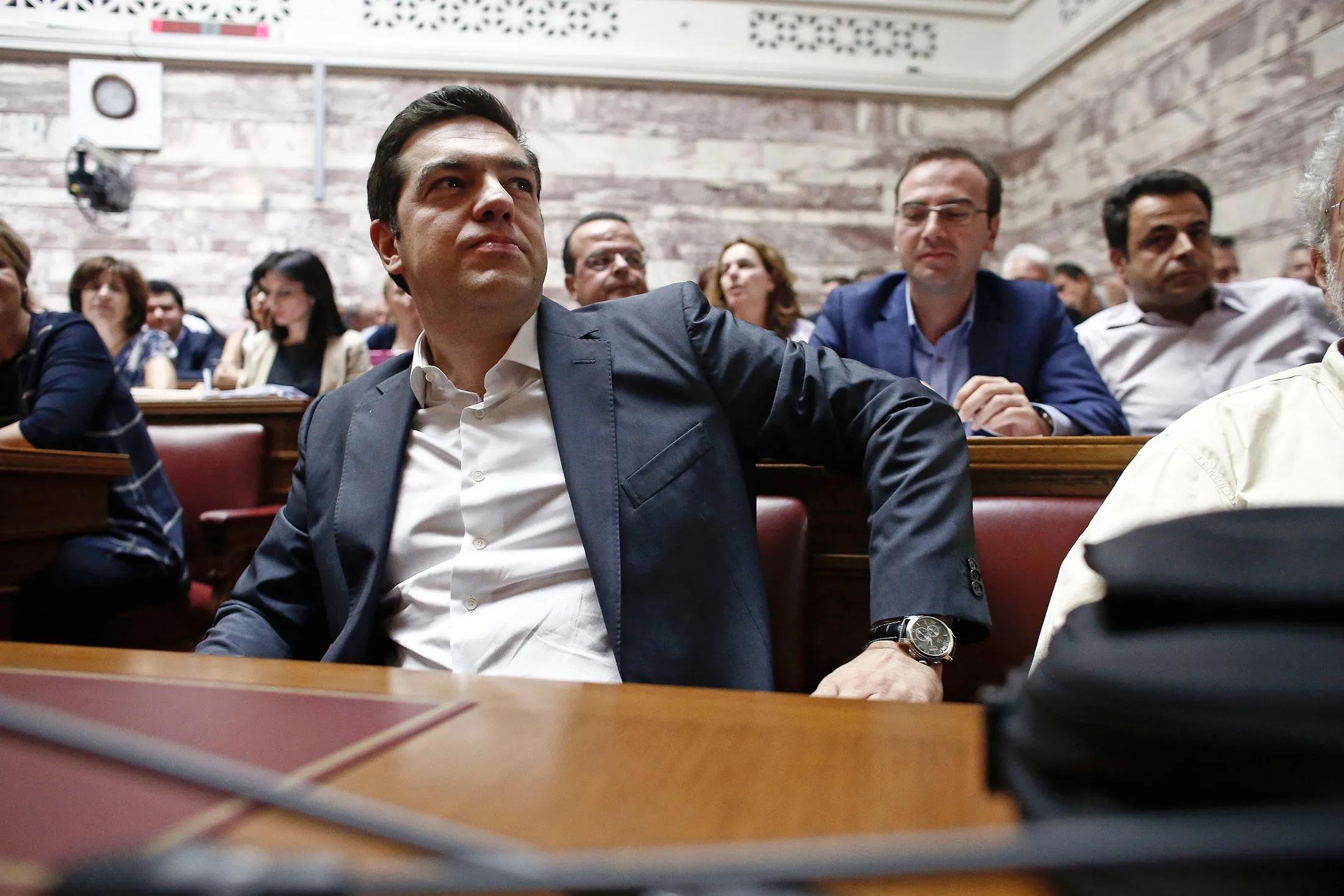 Alexis Tsipras, Greece's prime minister, prepares to take part in a parliamentary meeting of Syriza party lawmakers in Athens, Greece, on Wednesday, July 15, 2015.
