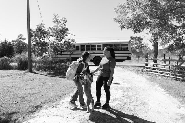 Nunez picks up her daughter Isabelle, 10, from the school bus stop. 