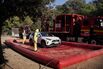 Spanish military personnel carry out protective decontamination of vehicles near Cerdanyola del Valles, on Dec. 3. Photographer: Manaure Quintero/AFP/Getty Images