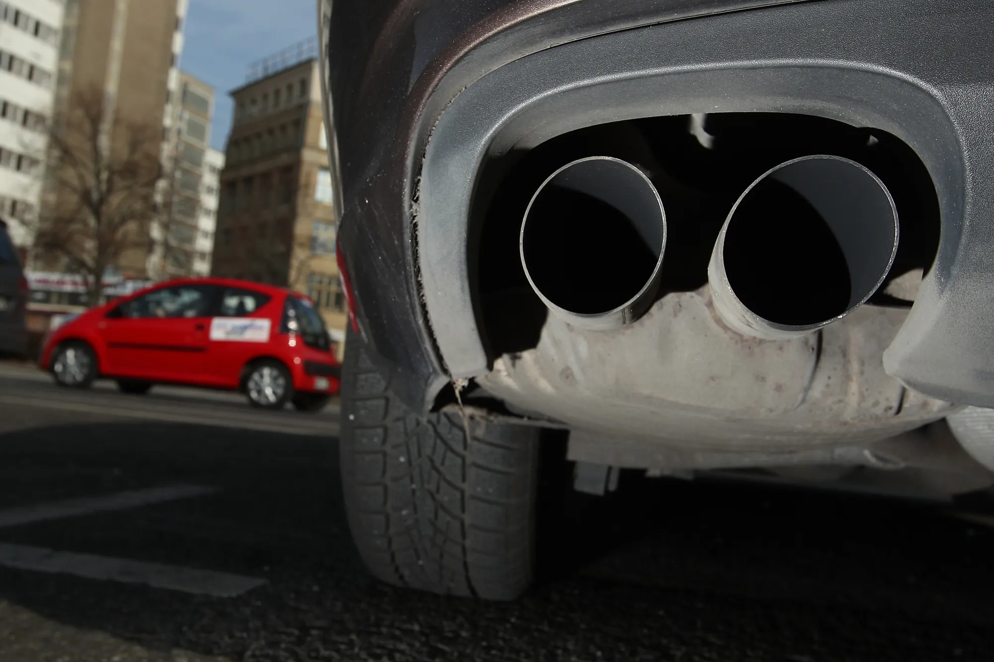 The exhaust pipes of a car are seen.