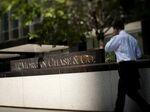 Pedestrians pass in front of the JPMorgan Chase & Co. headquarters in New York.