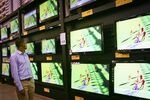 A shopper views televisions for sale at a Makro store in Johannesburg