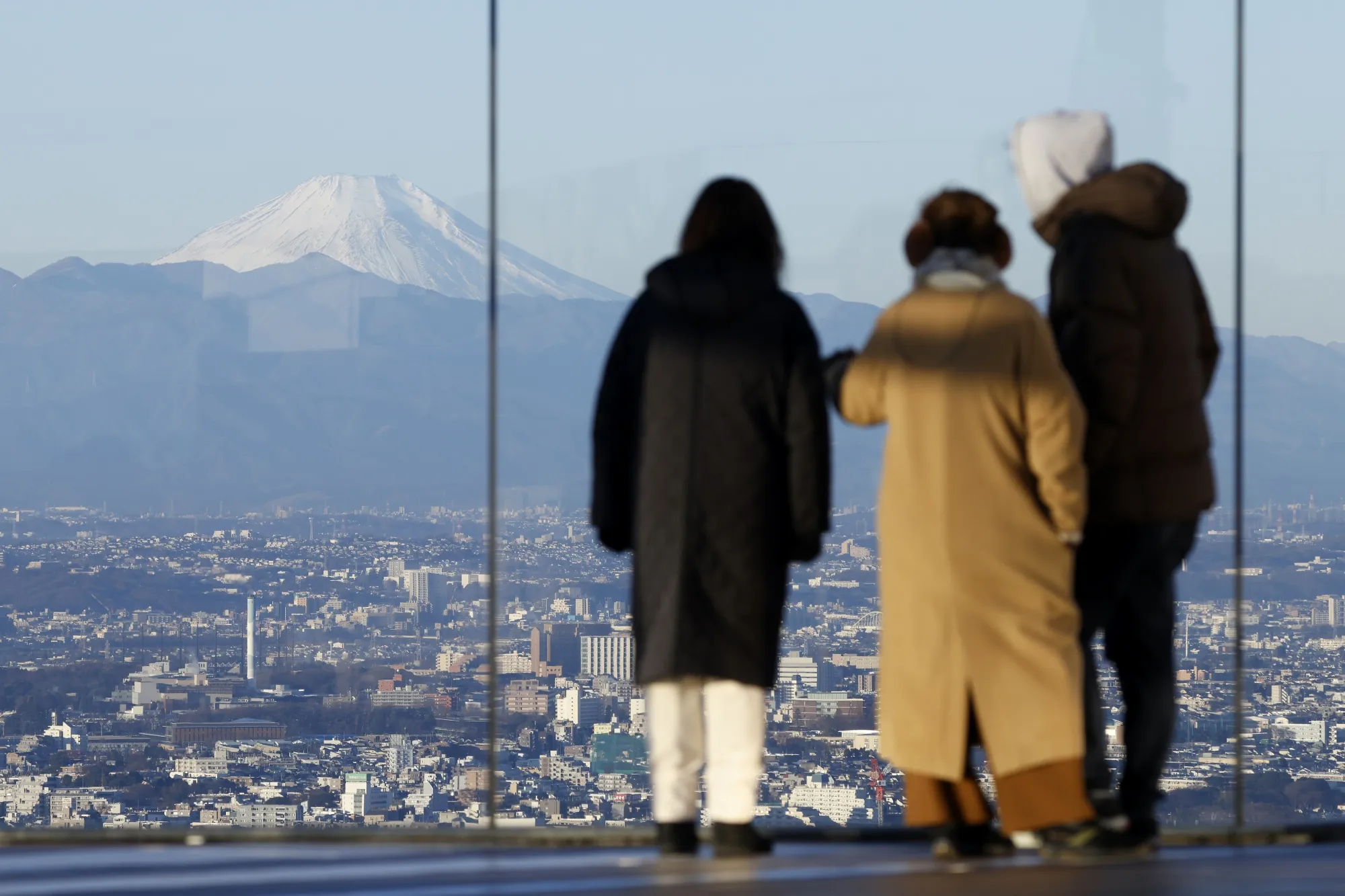 Mt. Fuji, left, seen from the Shibuya Sky observation deck in Tokyo.