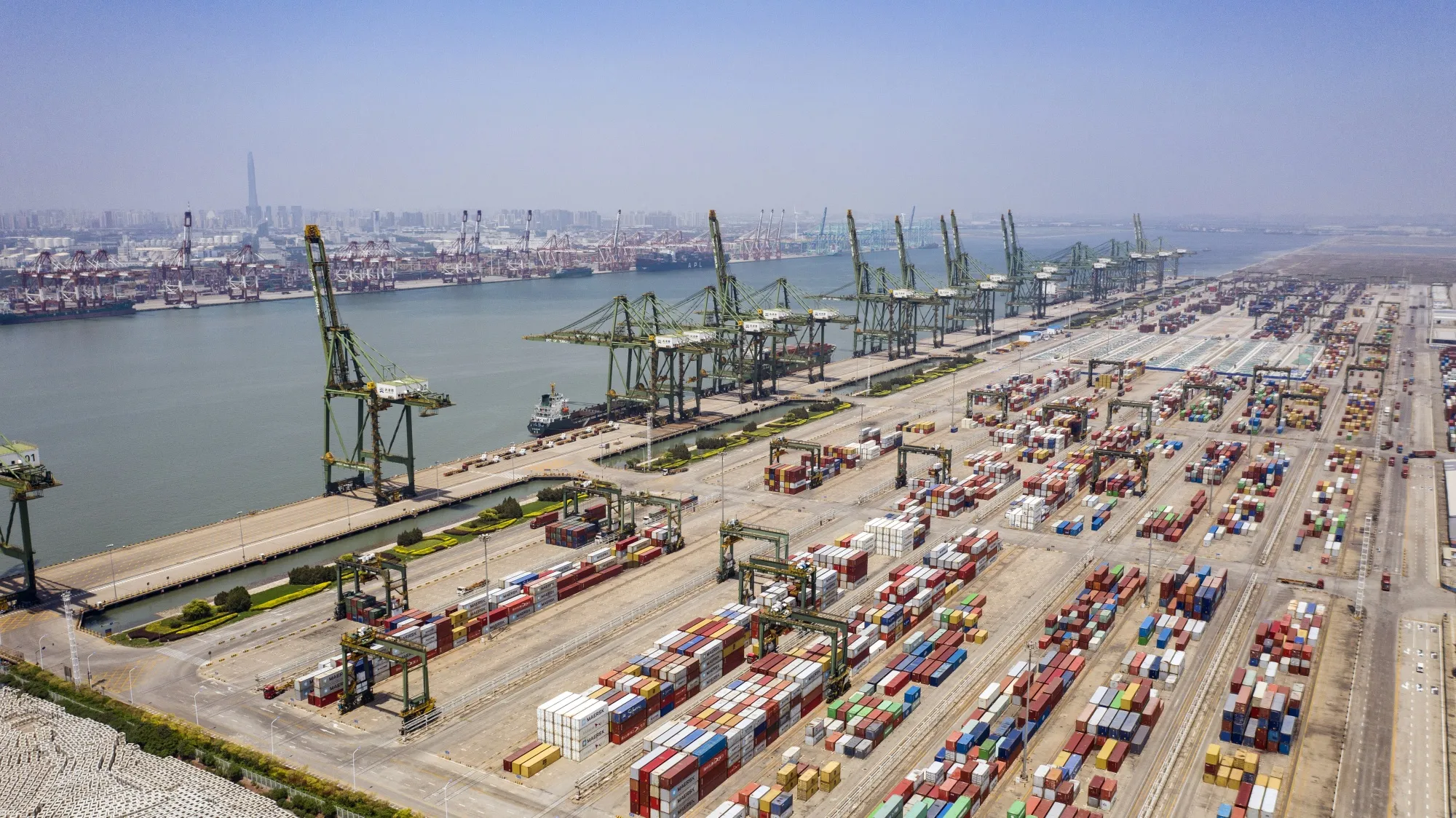 Shipping containers and gantry cranes at Tianjin port in Tianjin.