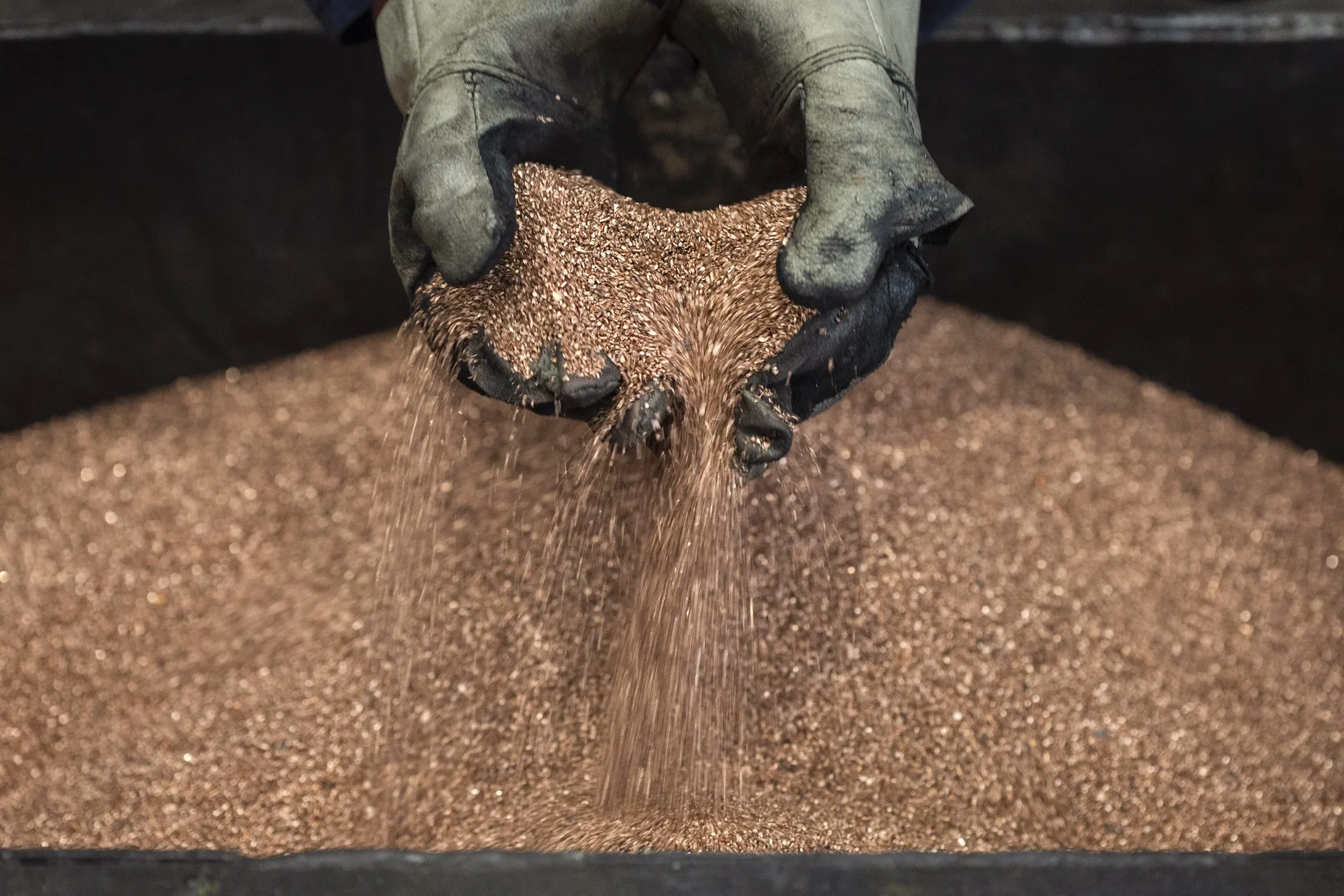 A person sifts through&nbsp;copper shavings at a&nbsp;copper mill in Sevojno, Serbia.&nbsp;