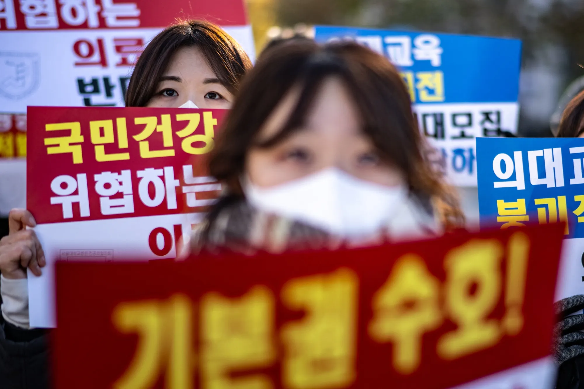 A group of trainee doctors protest against President Yoon Suk Yeol in Seoul on Dec. 8.