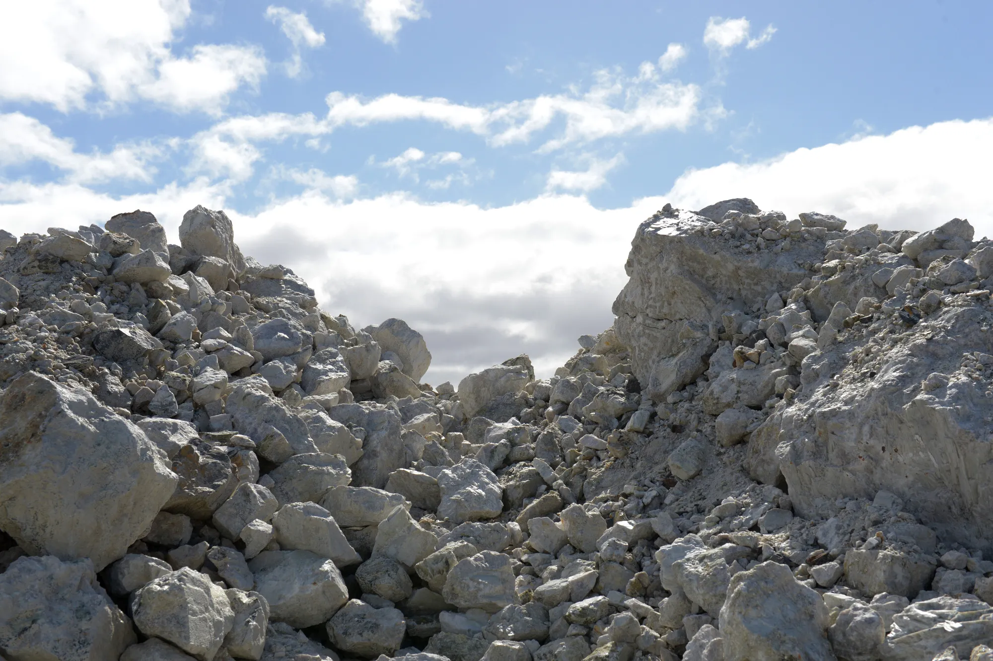 Rocks containing spodumene, a lithium raw material, sit in a stockpile prior to crushing at a lithium mine site in Australia.