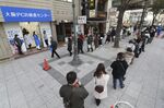 People line up in front of a Covid-19 testing site in Osaka City on Jan. 15.