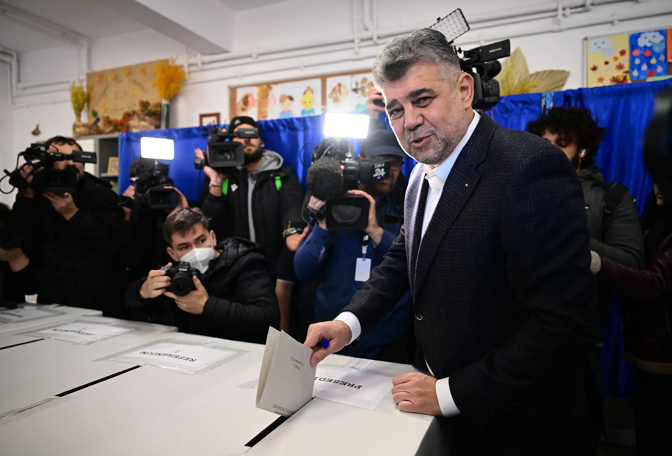 Marcel Ciolacu casts a ballot at a polling station during in the first round of the presidential elections in Bucharest on Nov. 24.