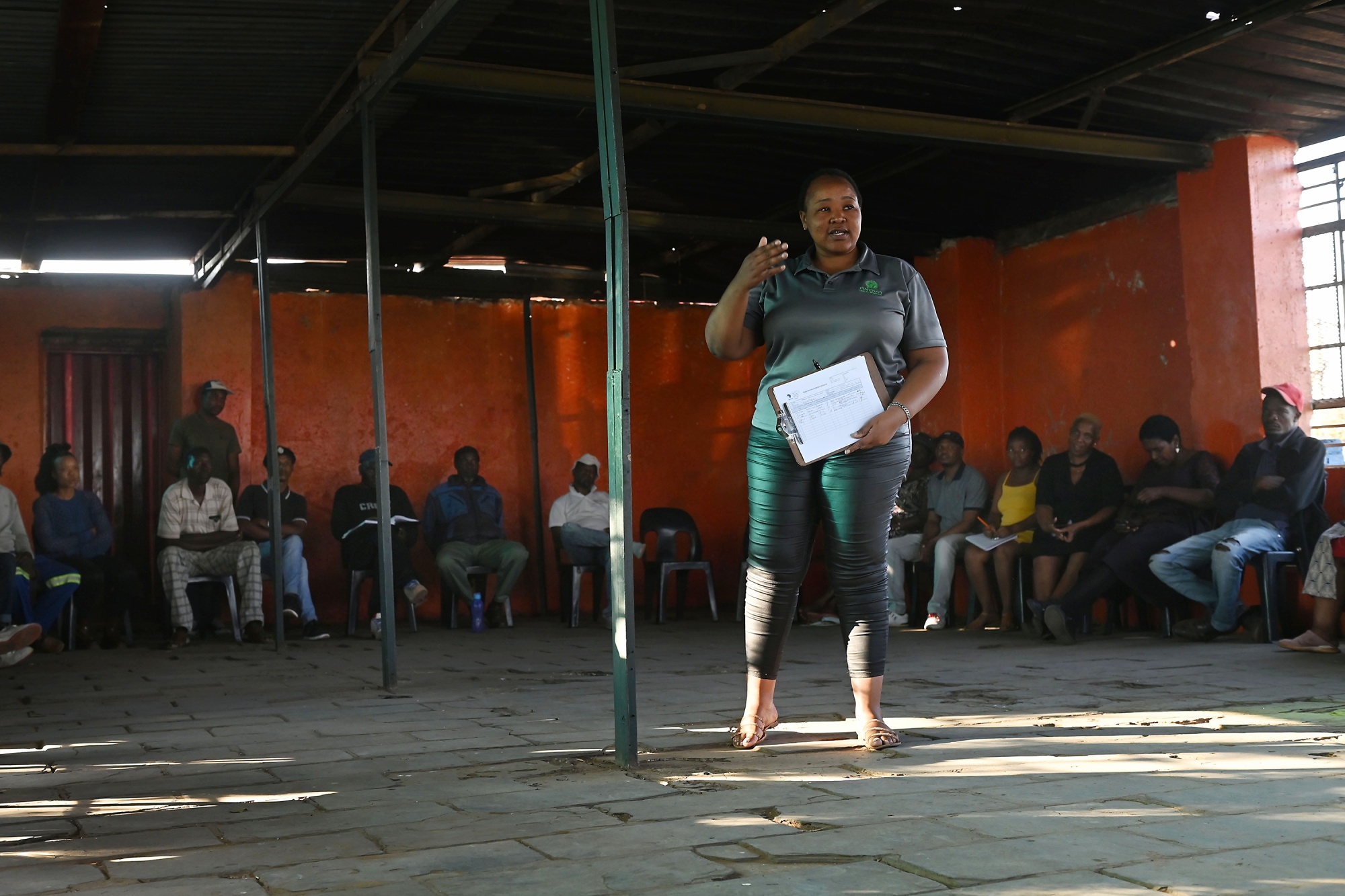 Slovo Park residents attend a meeting at the Slovo Community Hall to discuss issues affecting their quality of life.