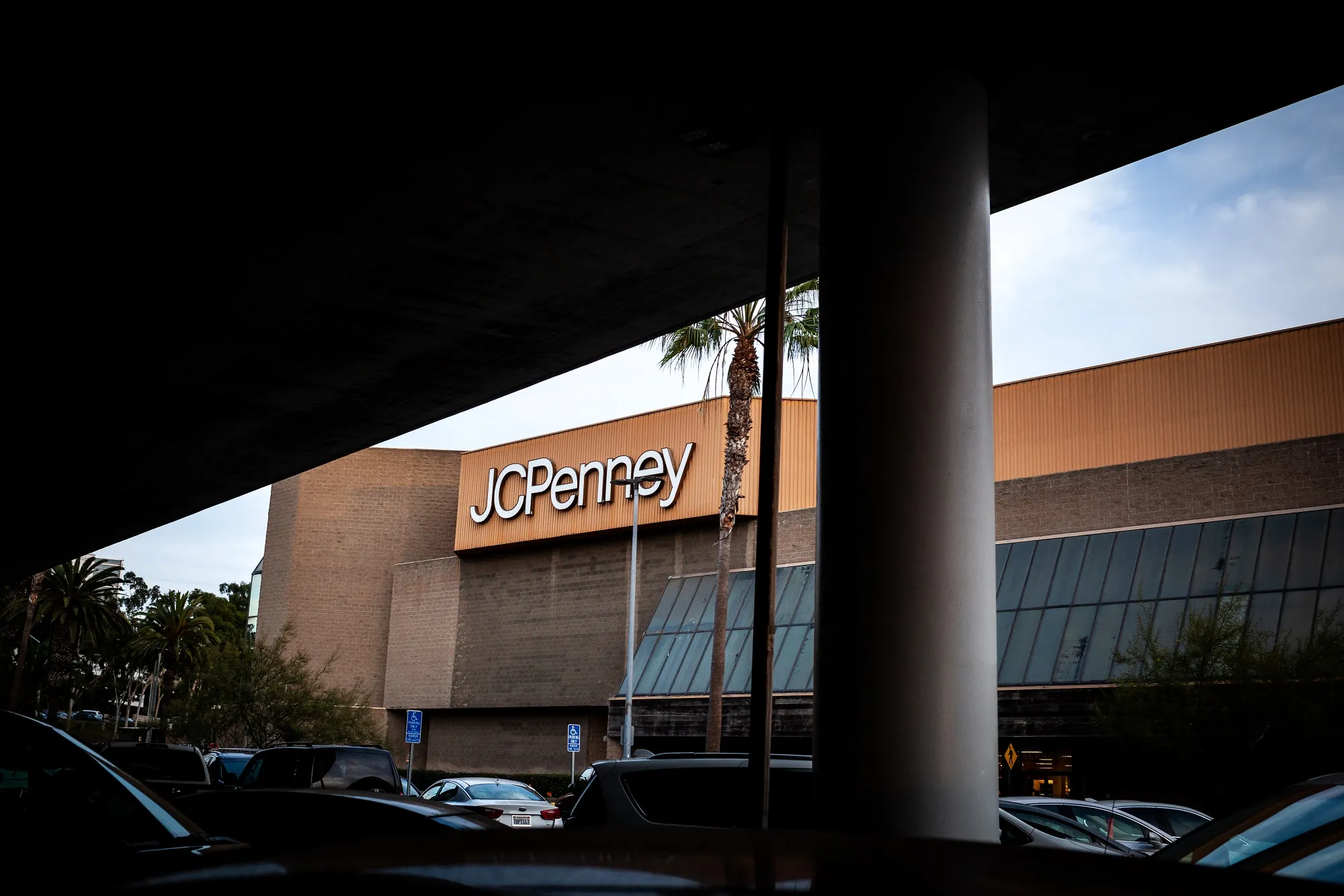 Vehicles sit parked outside of a J.C. Penney store in Culver City, California.