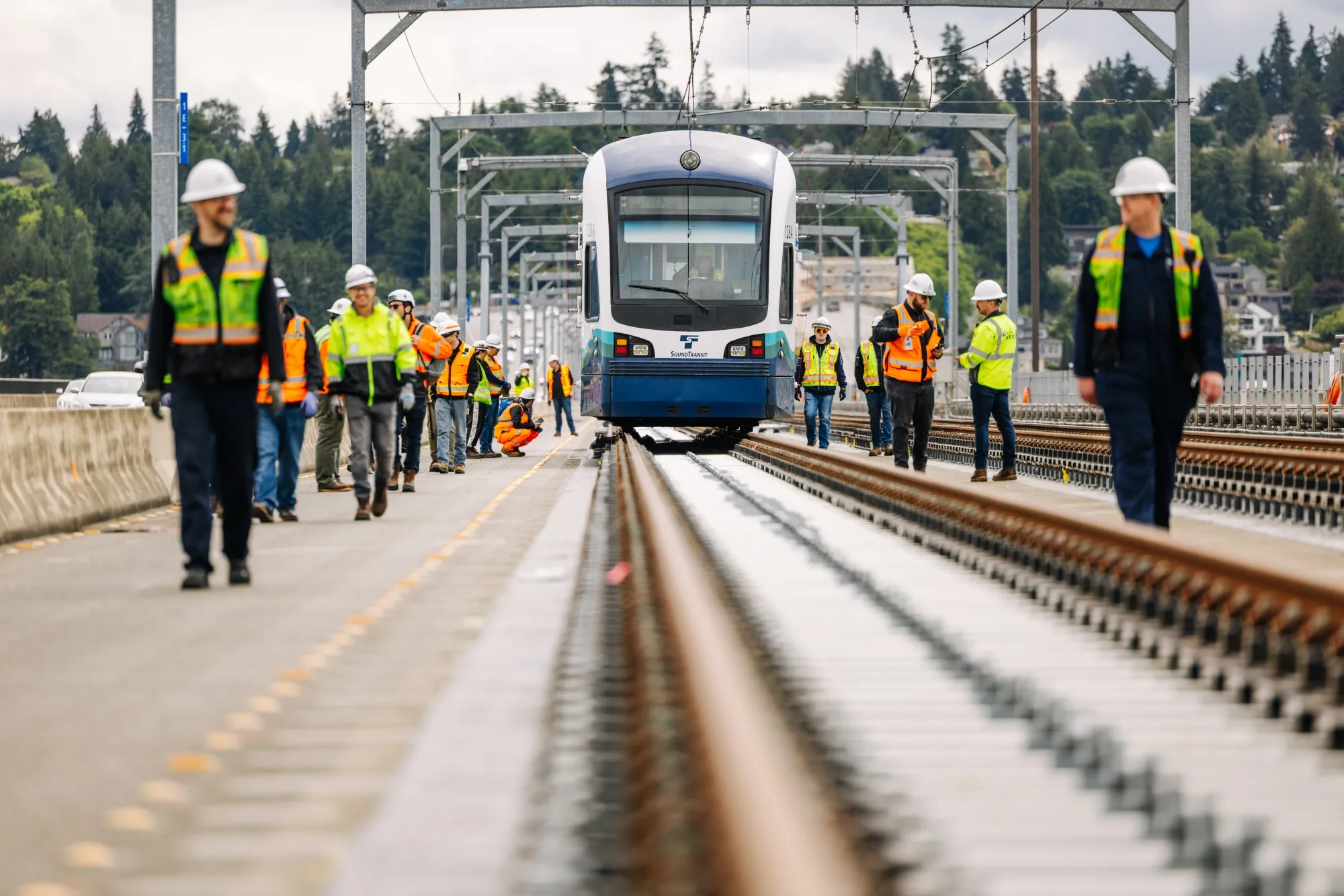 A test Link train makes its way across Seattle’s&nbsp;I-90 bridge&nbsp;in 2025. It’s the first-ever example of a light rail system&nbsp;on a floating bridge.&nbsp;