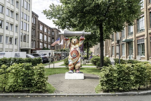 The “Berlin Bear” holds up a gas turbine model at the entrance of Siemens Energy’s plant in Berlin.