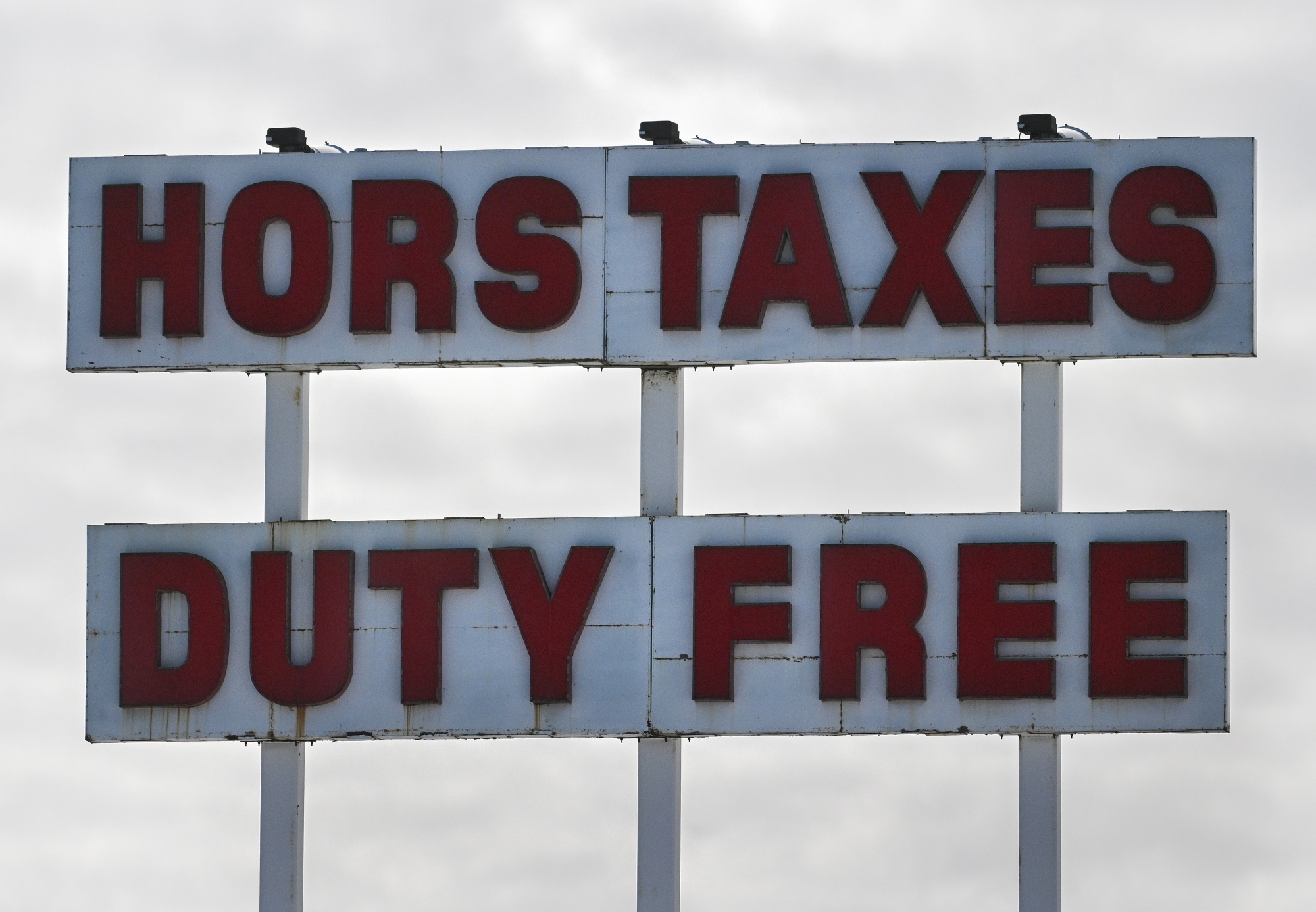 A Duty Free sign at the Canada-US border in Saint-Bernard-de-Lacolle, Quebec, Canada, on Tuesday, Feb. 24, 2026. The US Supreme Court's decision to strike down many of Donald Trump's tariffs offers some relief to Mexico and Canada, but a much bigger set of risks still hangs over the trade relationship that joins the three countries. Photographer: Graham Hughes/Bloomberg