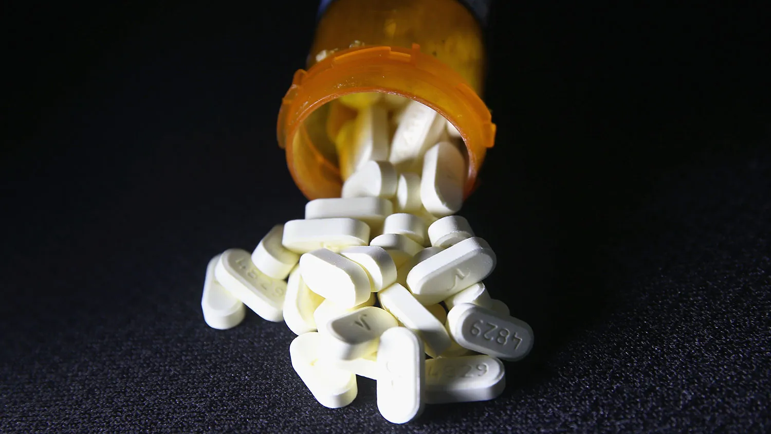 Oxycodone pain pills prescribed for a patient with chronic pain lie on display on March 23, 2016, in Norwich, Connecticut.
