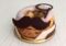 The Paris-London features a shirt collar, mustache and monocle.