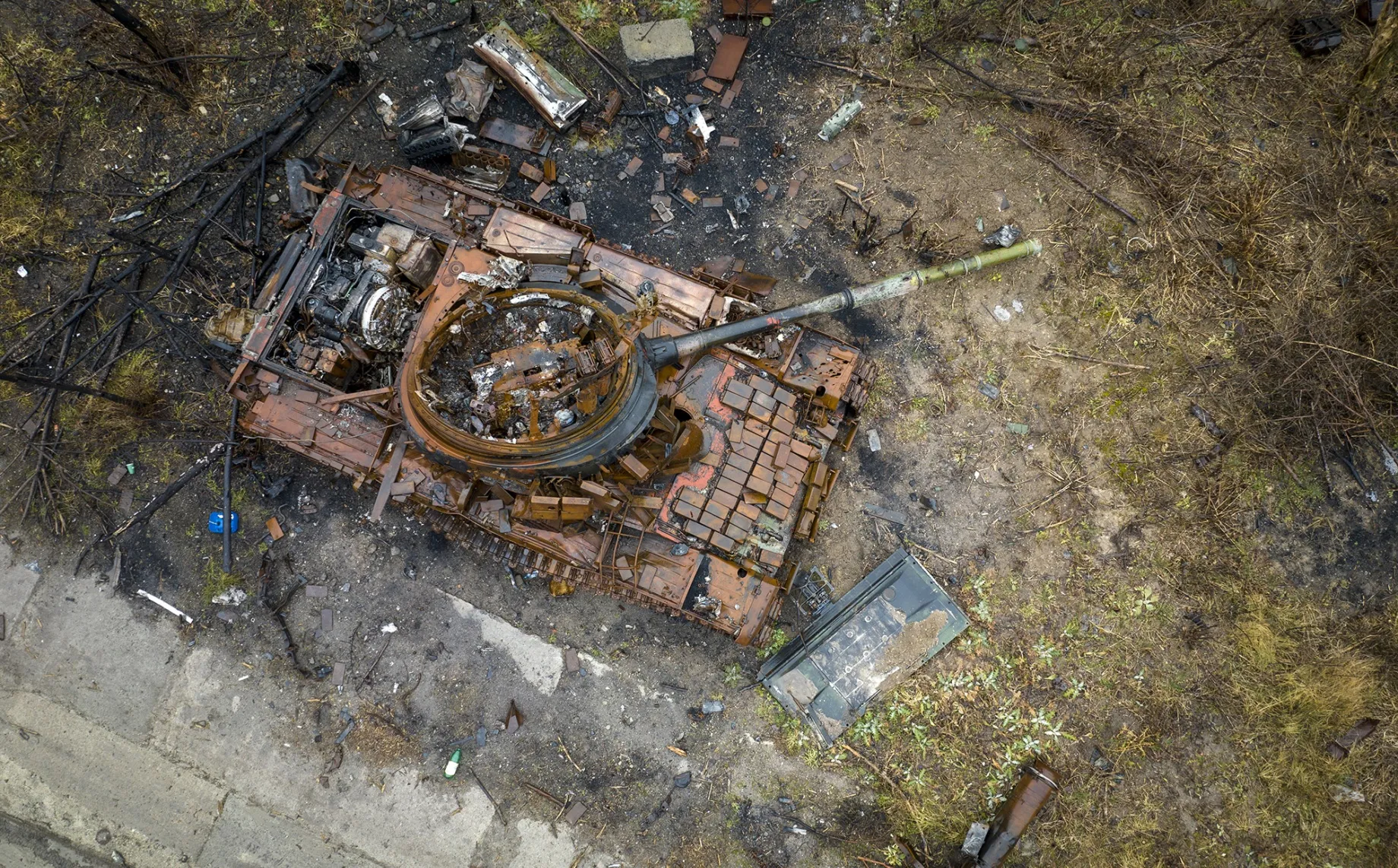 A destroyed Russian T-80 tank, its turret blown upside down, sits on a former frontline&nbsp;in Bogorodychne, in the Donbas region of eastern Ukraine, in Feb. 2023.&nbsp;